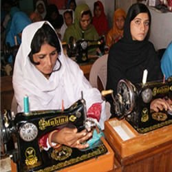 Women practising sewing at Chambeli’s vocational training center